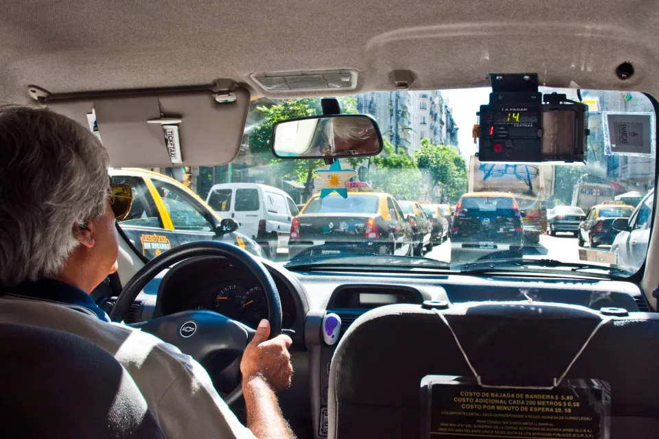 Interior of taxi with driver in Buenos Aires, Argentina